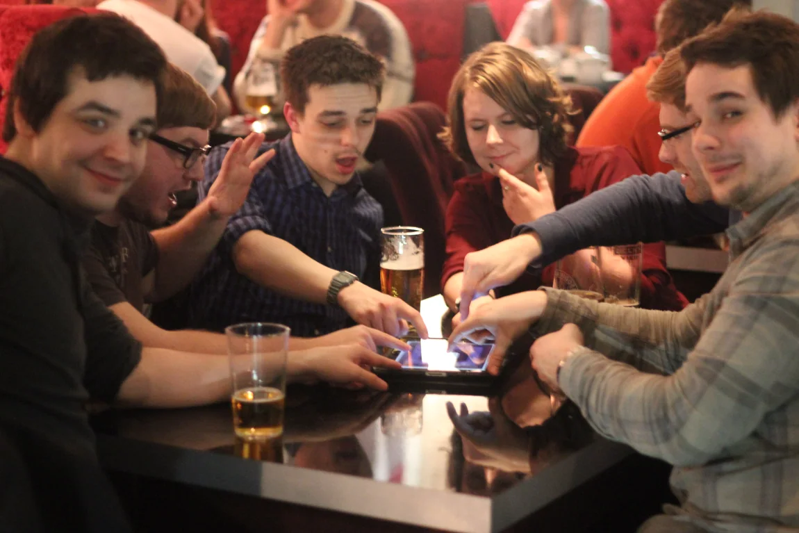 A group participating in a smartphone quiz